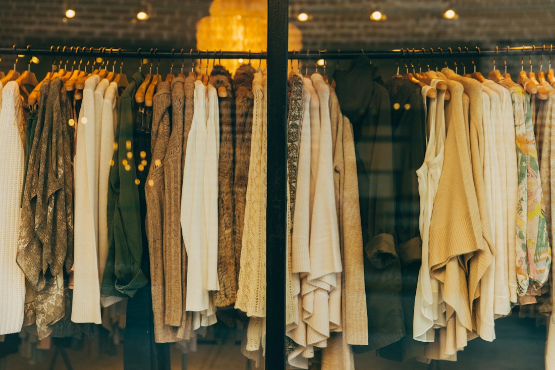 Clothing textures and colours arranged on a rail
